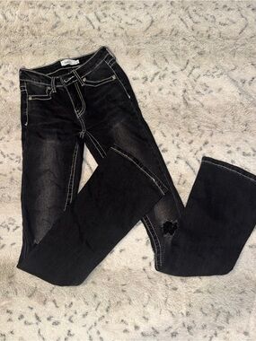 Y2k early 2000s black jeans with white stitching and design on pockets